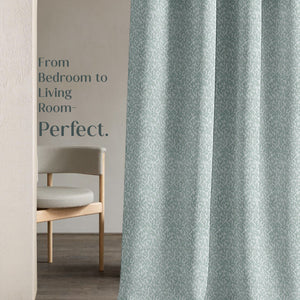 Gray curtain with text 'From Bedroom to Living Room- Perfect.' in a minimalistic room.
